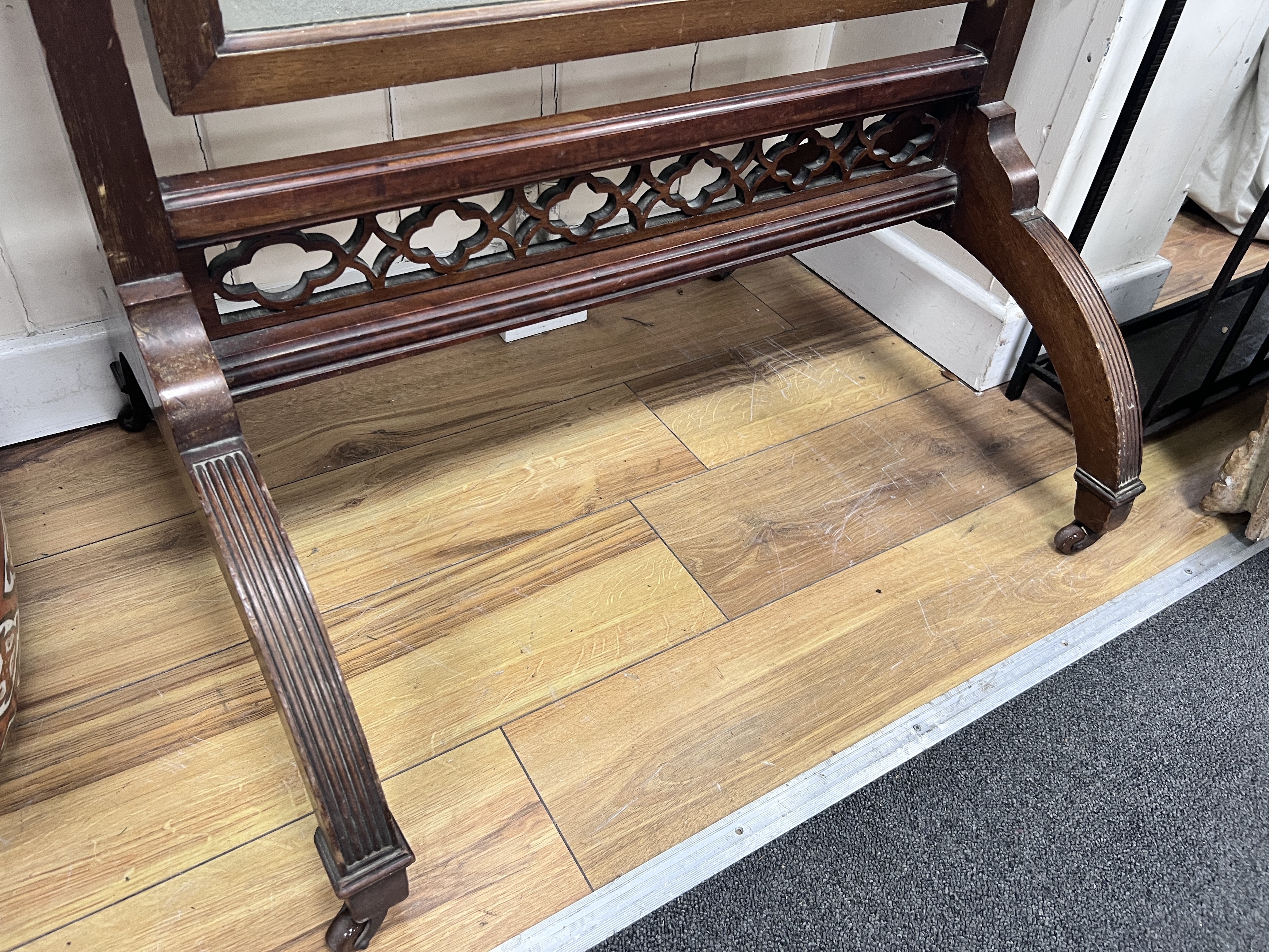 An Edwardian mahogany cheval mirror with fret cut frieze, width 70cm, height 161cm